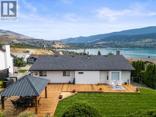Upper level house and backyard - 8990 College Drive, Coldstream, BC - Outdoor With Body Of Water With Deck Patio Veranda