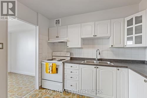2006 - 3390 Weston Road, Toronto, ON - Indoor Photo Showing Kitchen With Double Sink
