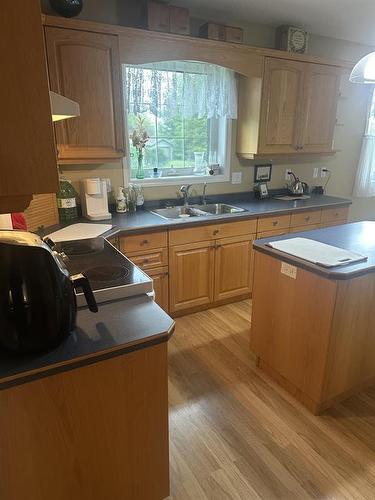 206 3Rd Street W, Swan River, MB - Indoor Photo Showing Kitchen With Double Sink