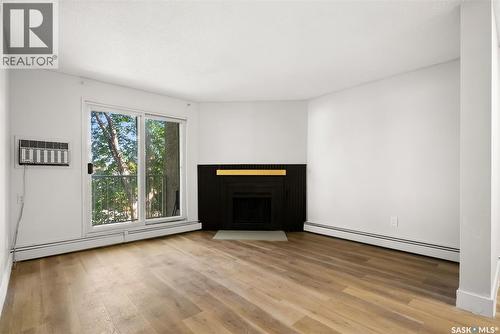 510 2406 Heseltine Road, Regina, SK - Indoor Photo Showing Living Room With Fireplace