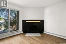 510 2406 Heseltine Road, Regina, SK  - Indoor Photo Showing Living Room With Fireplace 