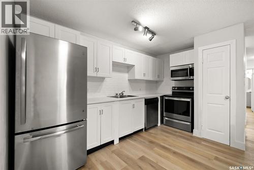 510 2406 Heseltine Road, Regina, SK - Indoor Photo Showing Kitchen With Double Sink
