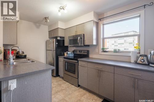 2320 5500 Mitchinson Way, Regina, SK - Indoor Photo Showing Kitchen With Stainless Steel Kitchen With Double Sink