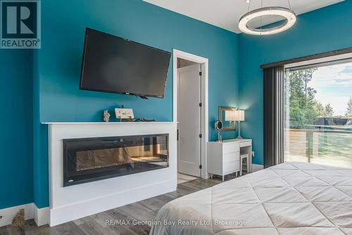 165 Wilson Road, Midland, ON - Indoor Photo Showing Bedroom With Fireplace