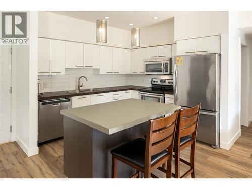 985 Academy Way Unit# 208, Kelowna, BC - Indoor Photo Showing Kitchen With Stainless Steel Kitchen With Double Sink