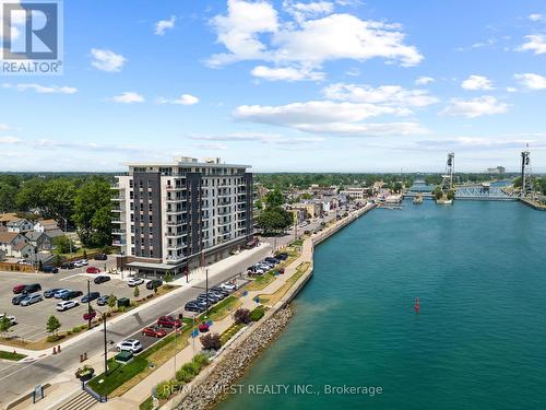 Next to restaurant, shops, spa's, cafe's and more - 502 - 118 West Street, Port Colborne, ON - Outdoor With Body Of Water With View