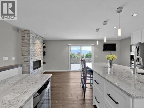 2284 Westville Place, West Kelowna, BC - Indoor Photo Showing Kitchen With Fireplace With Upgraded Kitchen