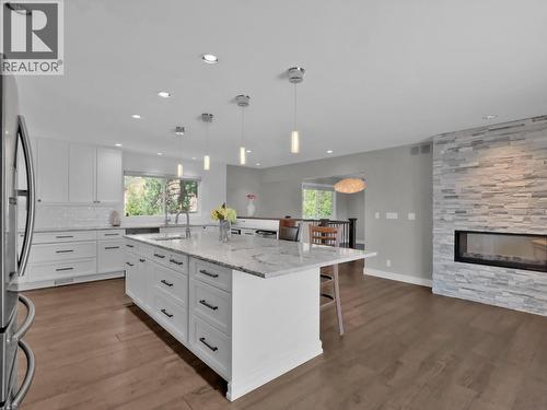 2284 Westville Place, West Kelowna, BC - Indoor Photo Showing Kitchen With Fireplace With Upgraded Kitchen