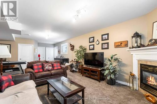 Basement  cozy rec room with walk out - 6295 Townline Road, West Lincoln (Smithville), ON - Indoor Photo Showing Living Room With Fireplace