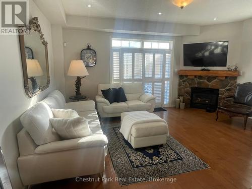 2 Cranberry Quay, Collingwood, ON - Indoor Photo Showing Living Room With Fireplace