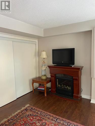 2 Cranberry Quay, Collingwood, ON - Indoor Photo Showing Living Room With Fireplace