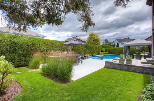 Face arrière - 610 Rue Des Vignobles, Rosemère, QC - Outdoor With In Ground Pool With Backyard