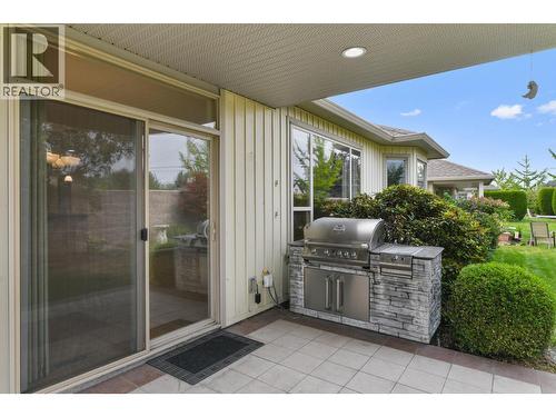 covered back patio with BBQ built in - 2365 Stillingfleet Road Unit# 39, Kelowna, BC - Outdoor With Exterior