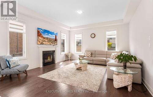 77 Pond View Gate, Hamilton, ON - Indoor Photo Showing Living Room With Fireplace