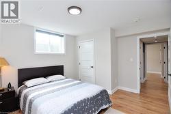 Bedroom featuring light wood-style flooring - 
