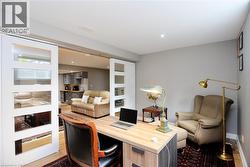 Home office featuring wood finished floors and baseboards - 