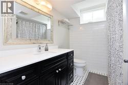 Bathroom featuring vanity and a shower with shower curtain - 