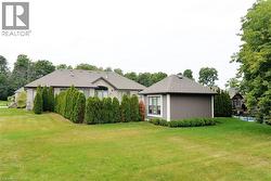 Rear view of property featuring a lawn - 