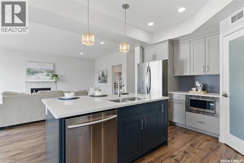 306 Secord Way, Saskatoon, SK - Indoor Photo Showing Kitchen With Stainless Steel Kitchen With Double Sink With Upgraded Kitchen