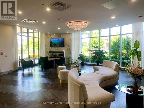 313 - 7711 Green Vista Gate, Niagara Falls (Oldfield), ON - Indoor Photo Showing Living Room With Fireplace