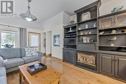 Suite - Main Floor Living Rm, Cozy FP, Built-ins - 