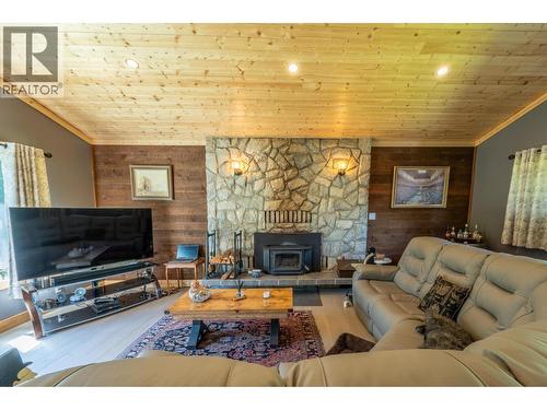 1732 Oberg Johnson Road, Golden, BC - Indoor Photo Showing Living Room With Fireplace