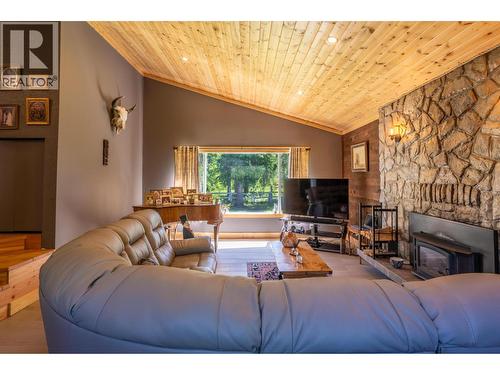 1732 Oberg Johnson Road, Golden, BC - Indoor Photo Showing Living Room With Fireplace