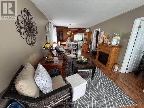 411 Tenth Avenue, Cochrane, ON - Indoor Photo Showing Living Room With Fireplace