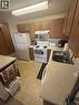 284 Yorkton Avenue Unit# 206, Penticton, BC  - Indoor Photo Showing Kitchen With Double Sink 