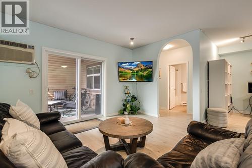 Arched doorways are a unique feature! - 151 Taylor Road Unit# 202, Kelowna, BC - Indoor Photo Showing Living Room