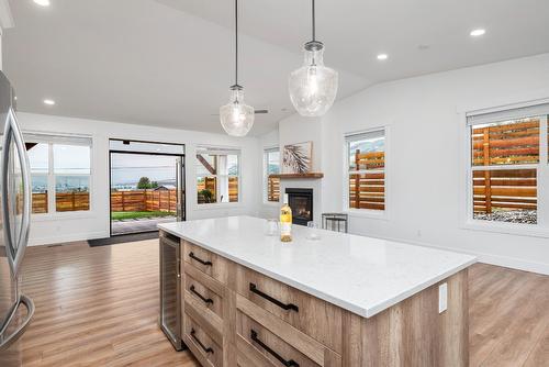 6448 Agassiz Road, Vernon, BC - Indoor Photo Showing Kitchen With Fireplace