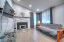 Salon - 6630 Rue Bruxelles, Brossard, QC  - Indoor With Fireplace 