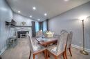 Salle à manger - 6630 Rue Bruxelles, Brossard, QC  - Indoor Photo Showing Dining Room With Fireplace 