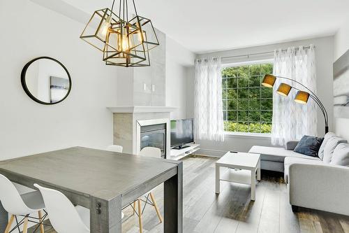 Salle à manger - 103-35 Mtée Victor-Nymark, Saint-Sauveur, QC - Indoor With Fireplace