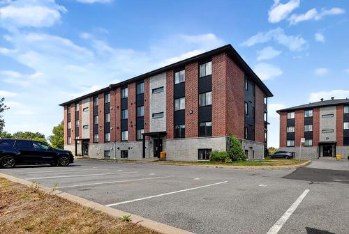 Parking - 102-147 Rue Principale, Saint-Basile-Le-Grand, QC - Outdoor With Facade