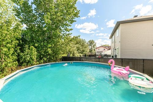 Piscine - 851 Rue Papineau, Laval (Saint-Vincent-De-Paul), QC - Outdoor With Above Ground Pool With Backyard