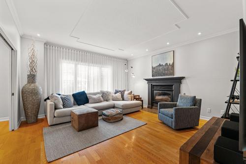 Living room - 155 Rue Des Hérons, La Prairie, QC - Indoor Photo Showing Living Room With Fireplace