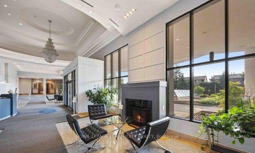 215-11121 Yonge Street, Richmond Hill, ON - Indoor Photo Showing Other Room With Fireplace