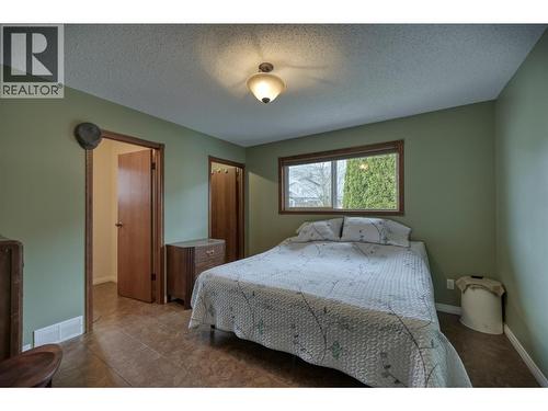 Primary Bedroom - 7460 Valley Heights Drive, Grand Forks, BC - Indoor Photo Showing Bedroom