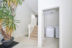 Welcome into the foyer - main floor laundry nearby - 