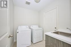 Main floor laundry room off garage - 