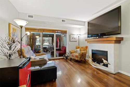 107-2142 Vasile Street, Kelowna, BC - Indoor Photo Showing Living Room With Fireplace