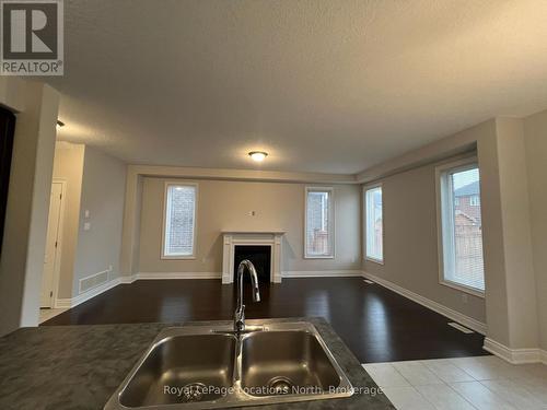 23 Lockerbie Crescent, Collingwood, ON - Indoor Photo Showing Kitchen With Fireplace With Double Sink