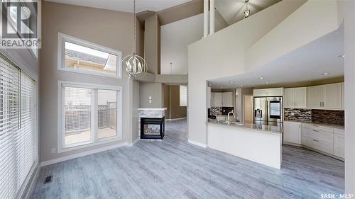 5006 Wascana Vista Court, Regina, SK - Indoor Photo Showing Kitchen With Fireplace
