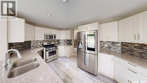 5006 Wascana Vista Court, Regina, SK - Indoor Photo Showing Kitchen With Stainless Steel Kitchen With Double Sink With Upgraded Kitchen