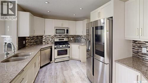 5006 Wascana Vista Court, Regina, SK - Indoor Photo Showing Kitchen With Stainless Steel Kitchen With Double Sink With Upgraded Kitchen