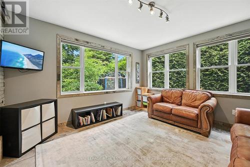 Family Room w/Heated Slate Floor and Garage Access - 4240 Dunvegan Road, Burlington, ON - Indoor Photo Showing Living Room