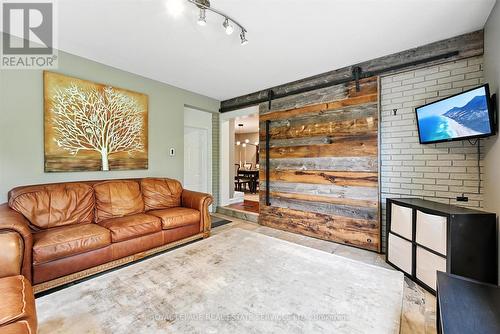 Family Room w/Heated Slate Floor and Garage Access - 4240 Dunvegan Road, Burlington, ON - Indoor Photo Showing Living Room