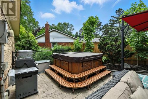 Professionally Landscaped Backyard with a Hot Tub - 4240 Dunvegan Road, Burlington, ON - Outdoor With Exterior