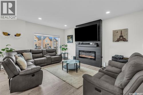 326 Prasad Union, Saskatoon, SK - Indoor Photo Showing Living Room With Fireplace